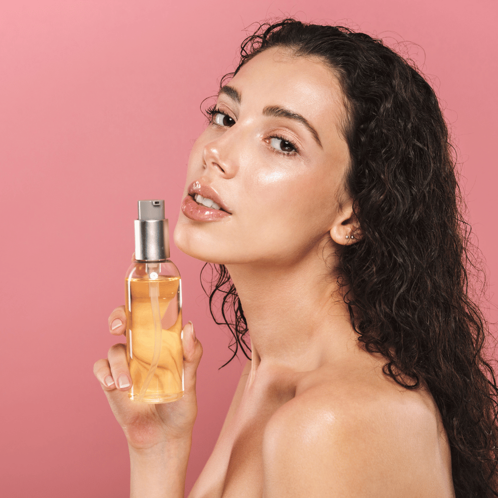 woman holding a cleansing oil