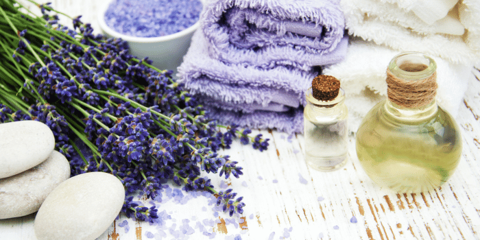 lavender body wash with lavender flowers, salts, and washcloth