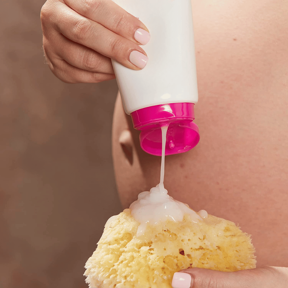 pregnant woman's belly and soap on a sponge