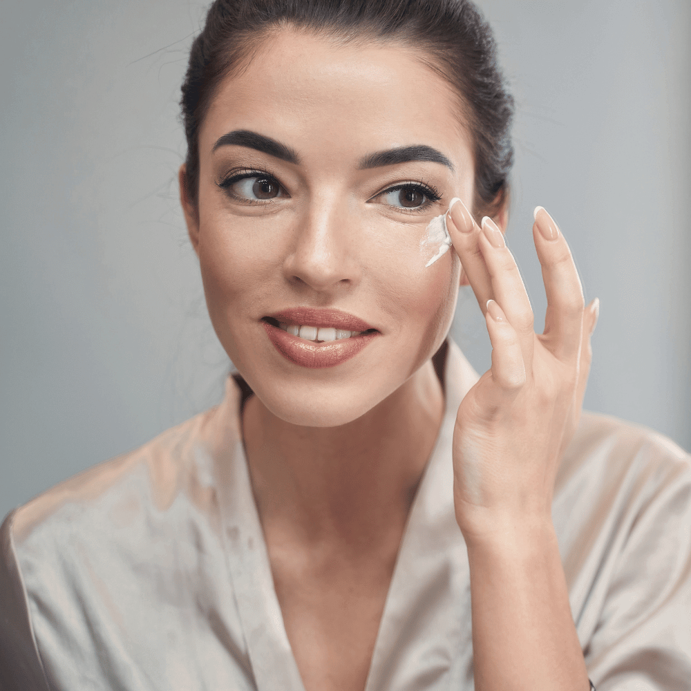 woman applying eye cream