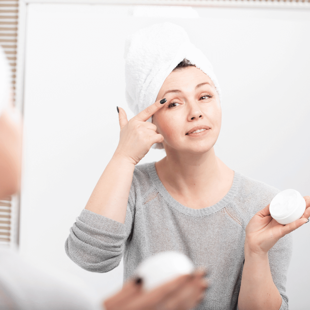 woman applying eye cream