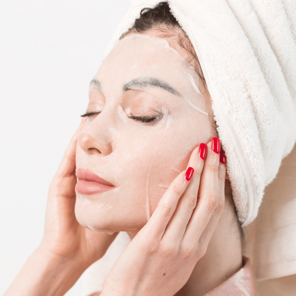 woman with a sheet mask on her face