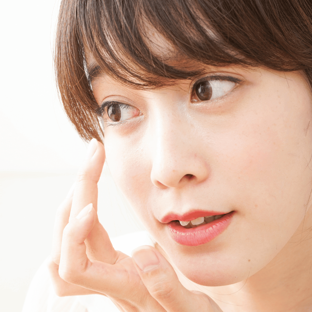 woman applying eye cream