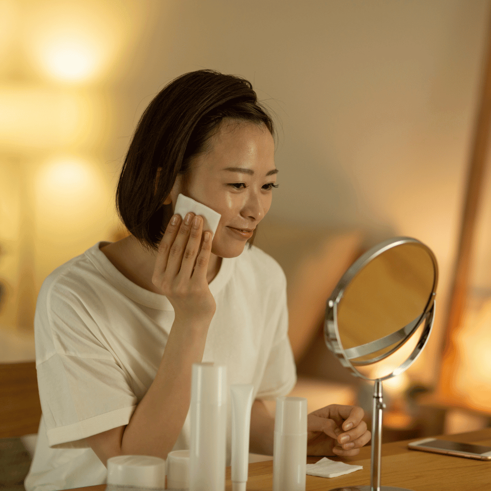 woman putting on her nighttime skincare